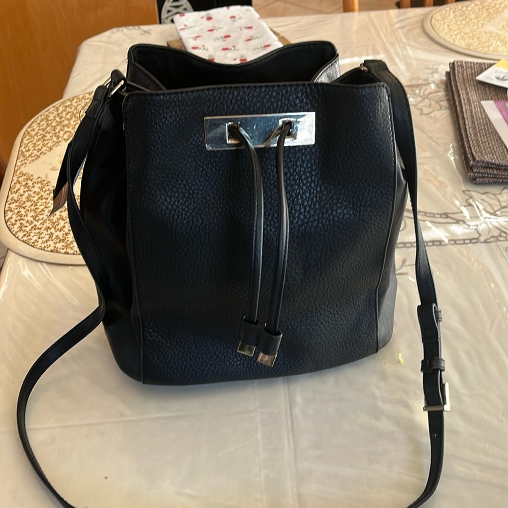 INC drawstring bag with 3 inside pockets ( one zippered). New with tags.